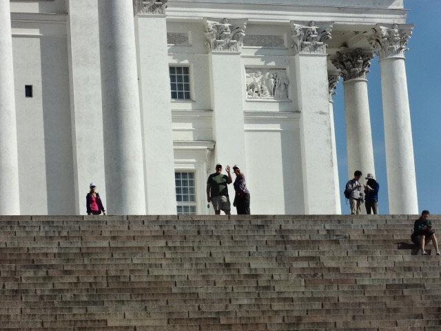 waving from the top of the steps